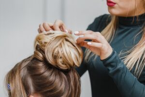 stylist helping client with hair