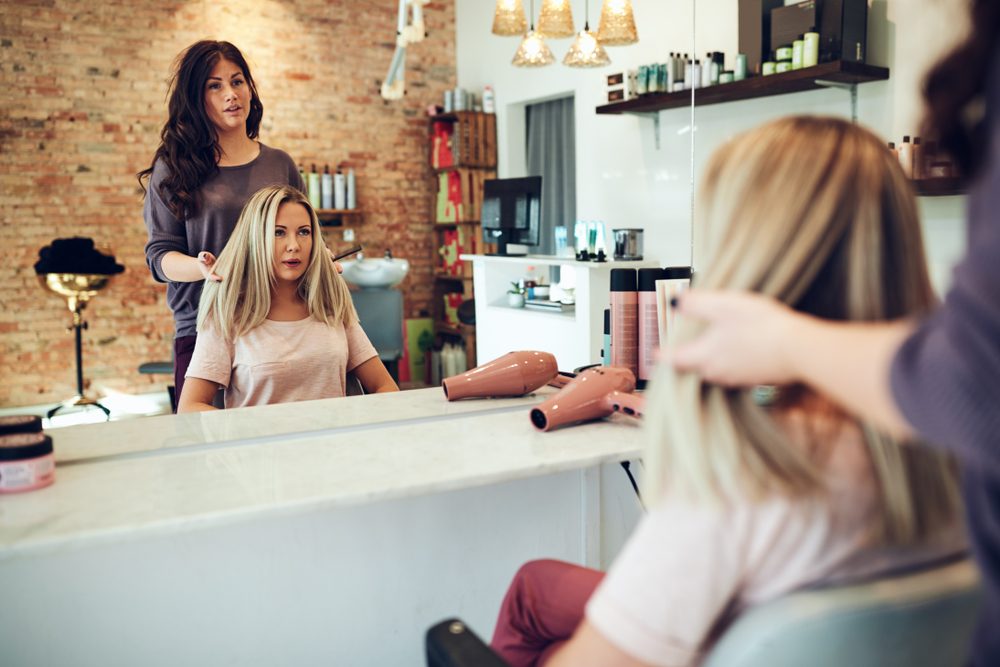 hairstylist talking with client