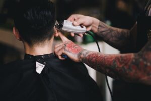 Barber shaving side of client's head