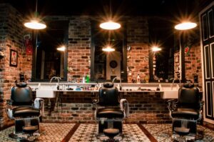 Interior of a barbershop with brick walls