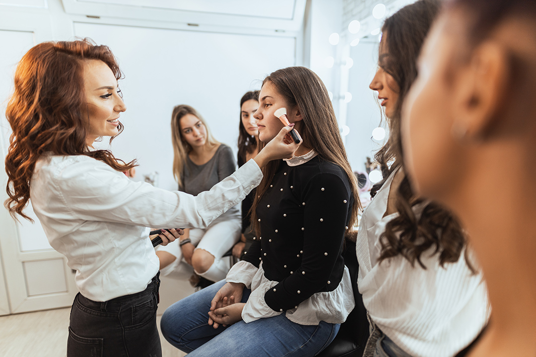 cosmetology teacher instructing students